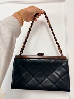 CHANEL Black Quilted Leather Shoulder Bag with Brown Wood Trim